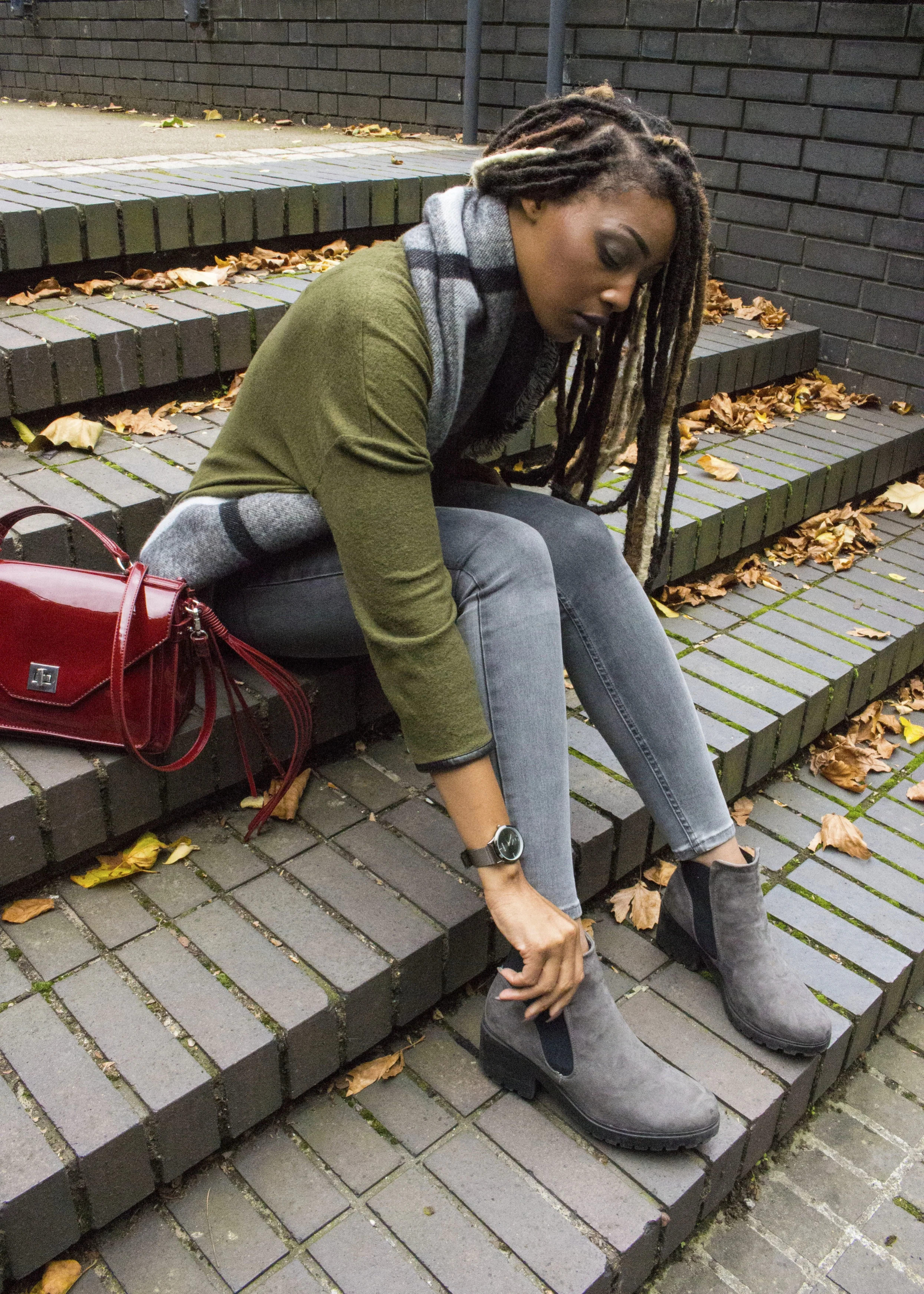Grey boots shop blue jeans